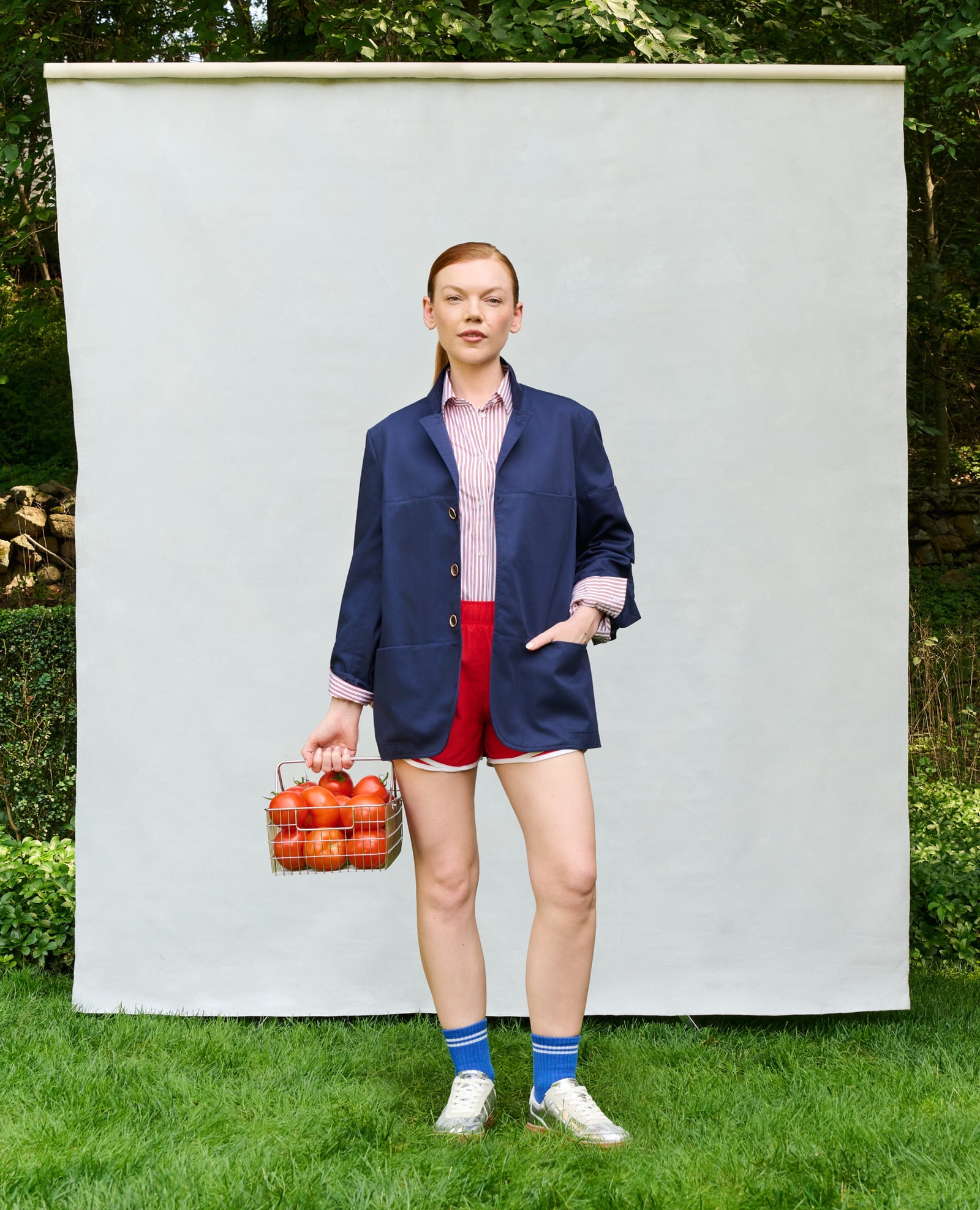 Female model wearing the navy Farnsworth Chore Coat, front view.