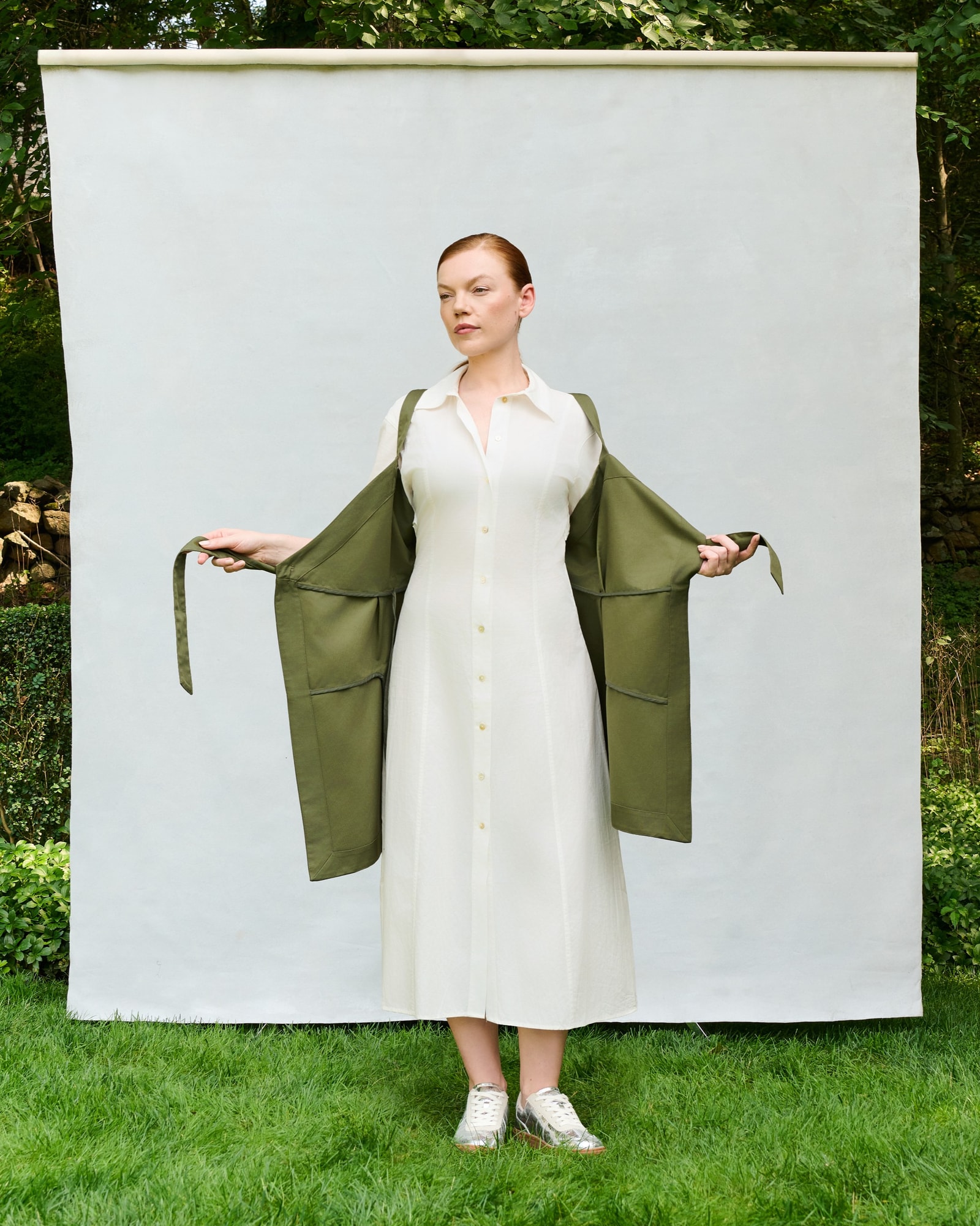 Model showing the olive Trigo Apron fully open.
